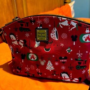 Dooney & Burke Walt Disney World Christmas purse
Red w/Disney Christmas figures.